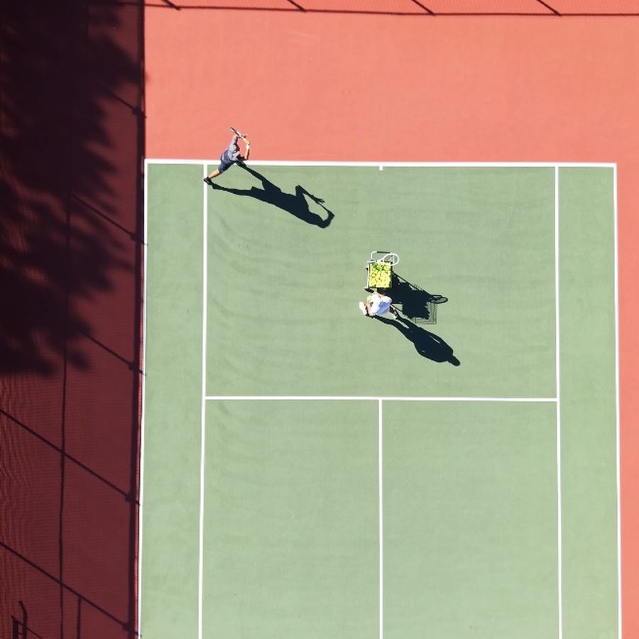 Aerial view of a coaching session on a tennis court